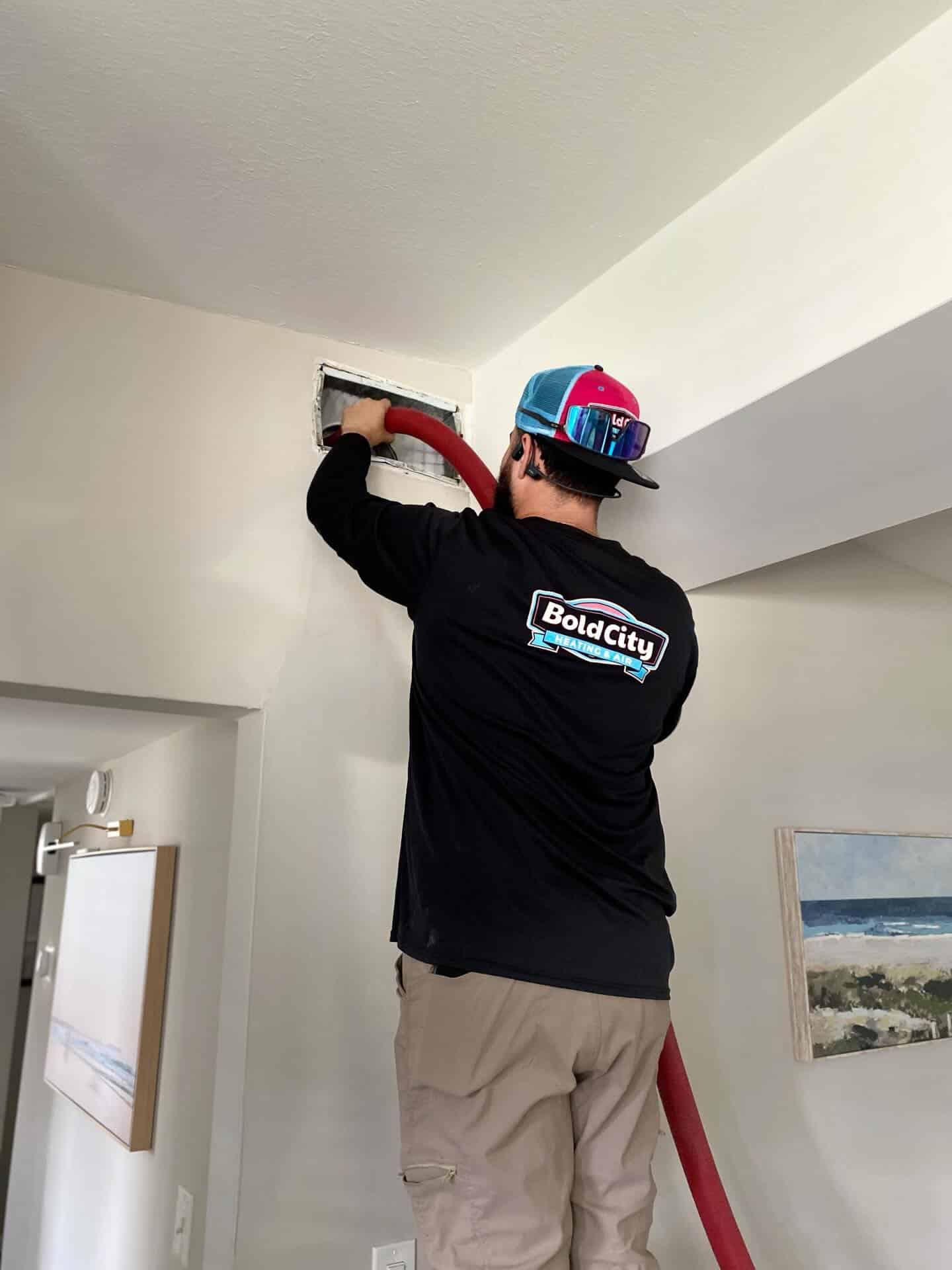 HVAC technician Cleaning HVAC ducts in Spring